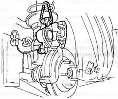 Рис.217. Суппорт тормозного механизма после освобождения нижнего пальца закрепить в указанном…