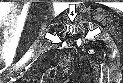 Unscrew the two mounting bolts (arrows) securing the brake cylinder from the rear side of the brake…
