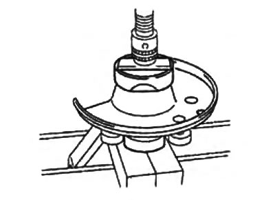 c) Using mandrels and a press, press the new mudguard onto the steering knuckle.